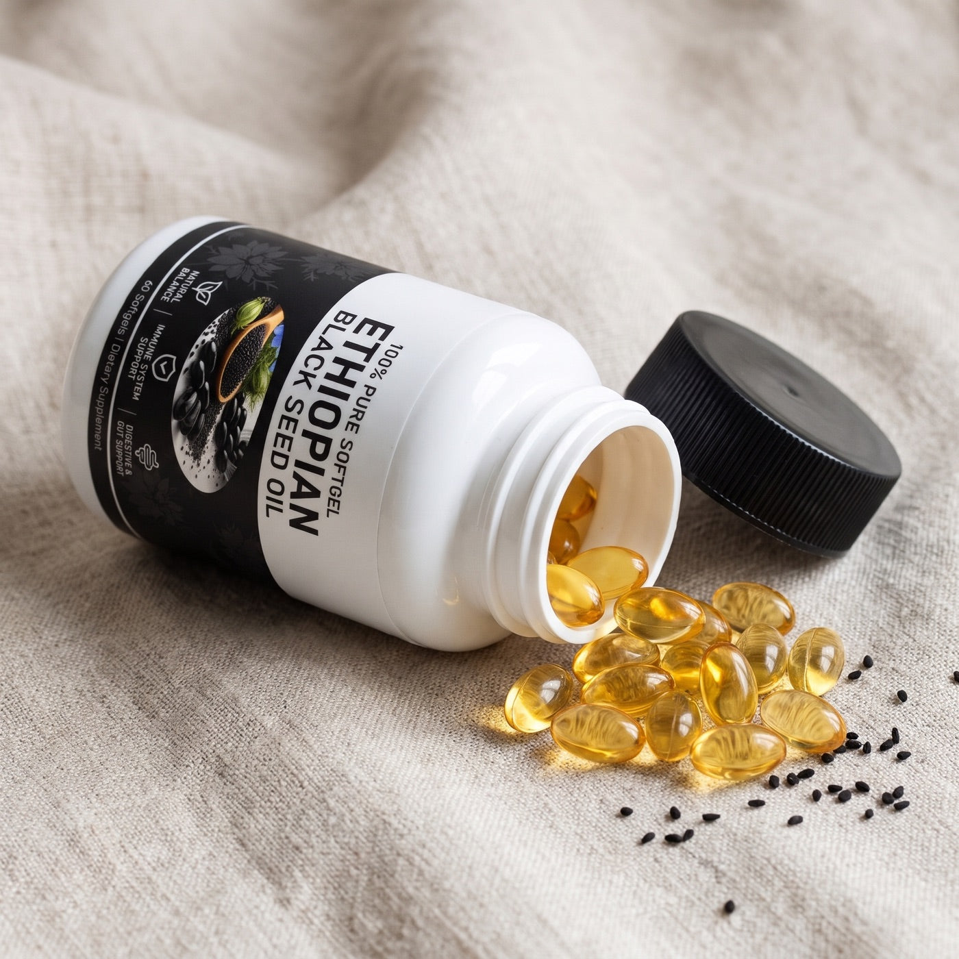 Golden softgels spilling from the bottle